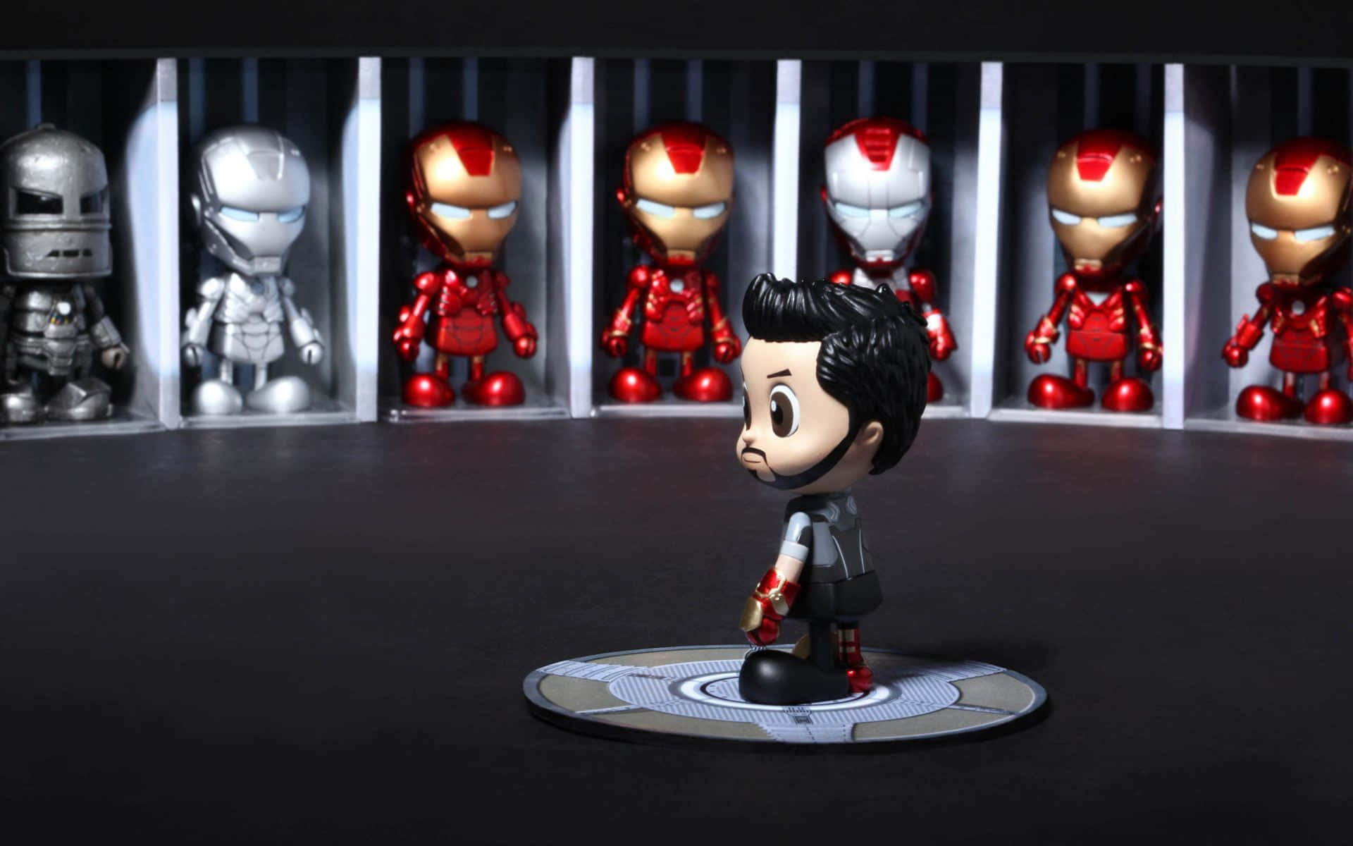 Bring the Marvel Cinematic Universe to life with Iron Man Action Figures Wallpaper