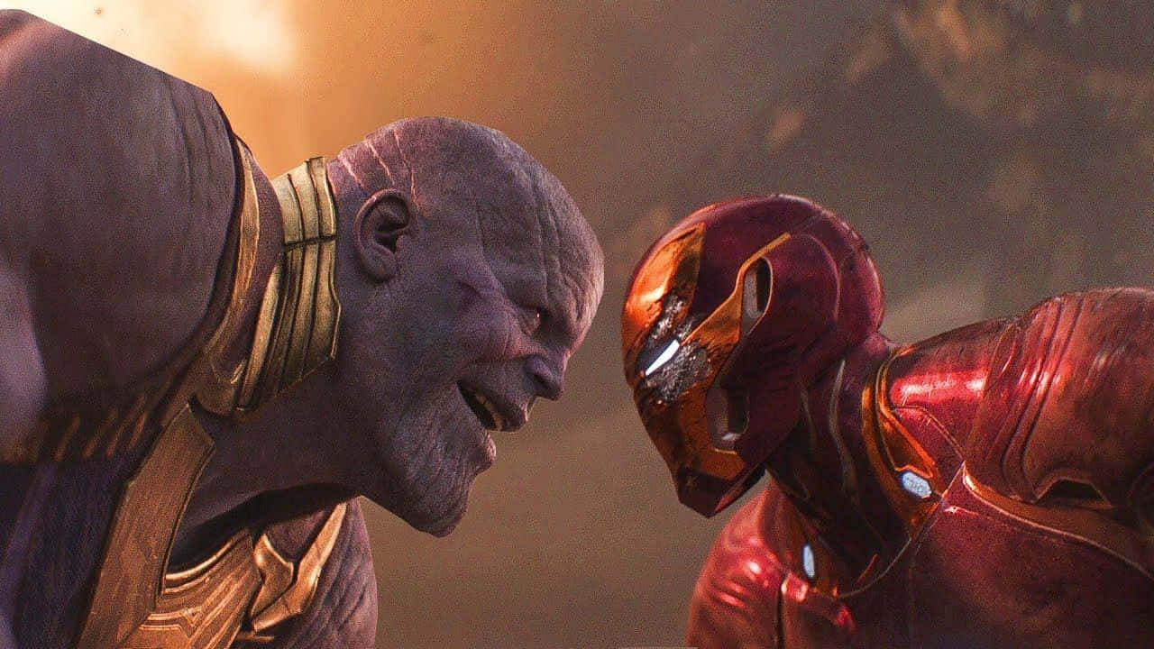 Iron Man and Thanos in an Epic Fight Wallpaper