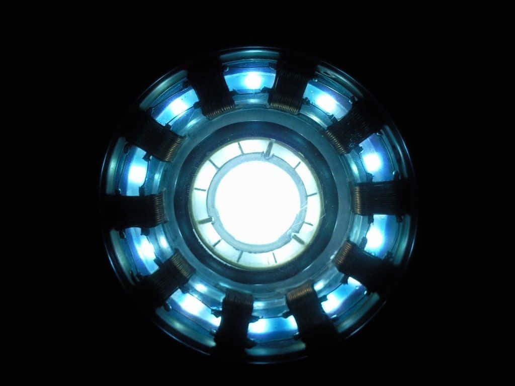 Iron Man Monument Illuminated by a Powerful Arc Reactor Wallpaper