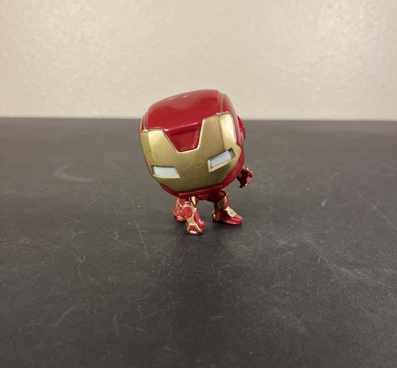 Collect and display your favorite Iron Man bobblehead figures Wallpaper