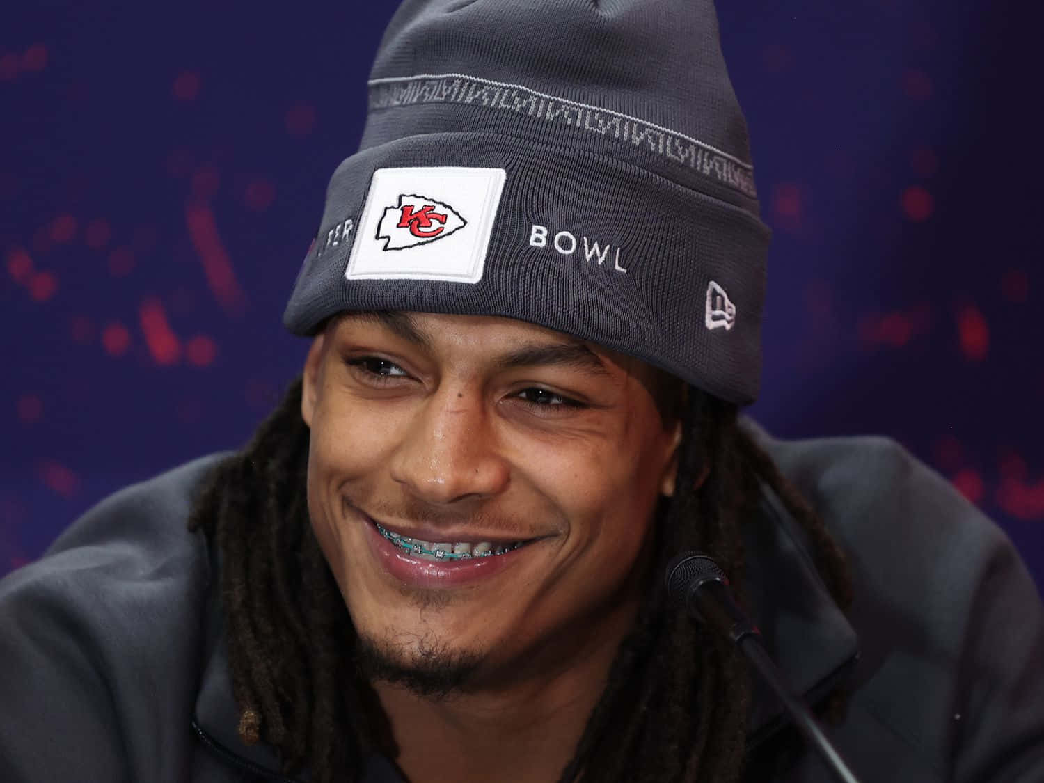 Isiah Pacheco Smiling During Press Conference Wallpaper