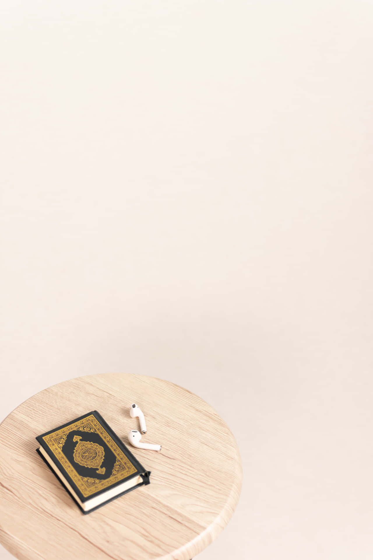 Quran Next To AirPods Islamic Background
