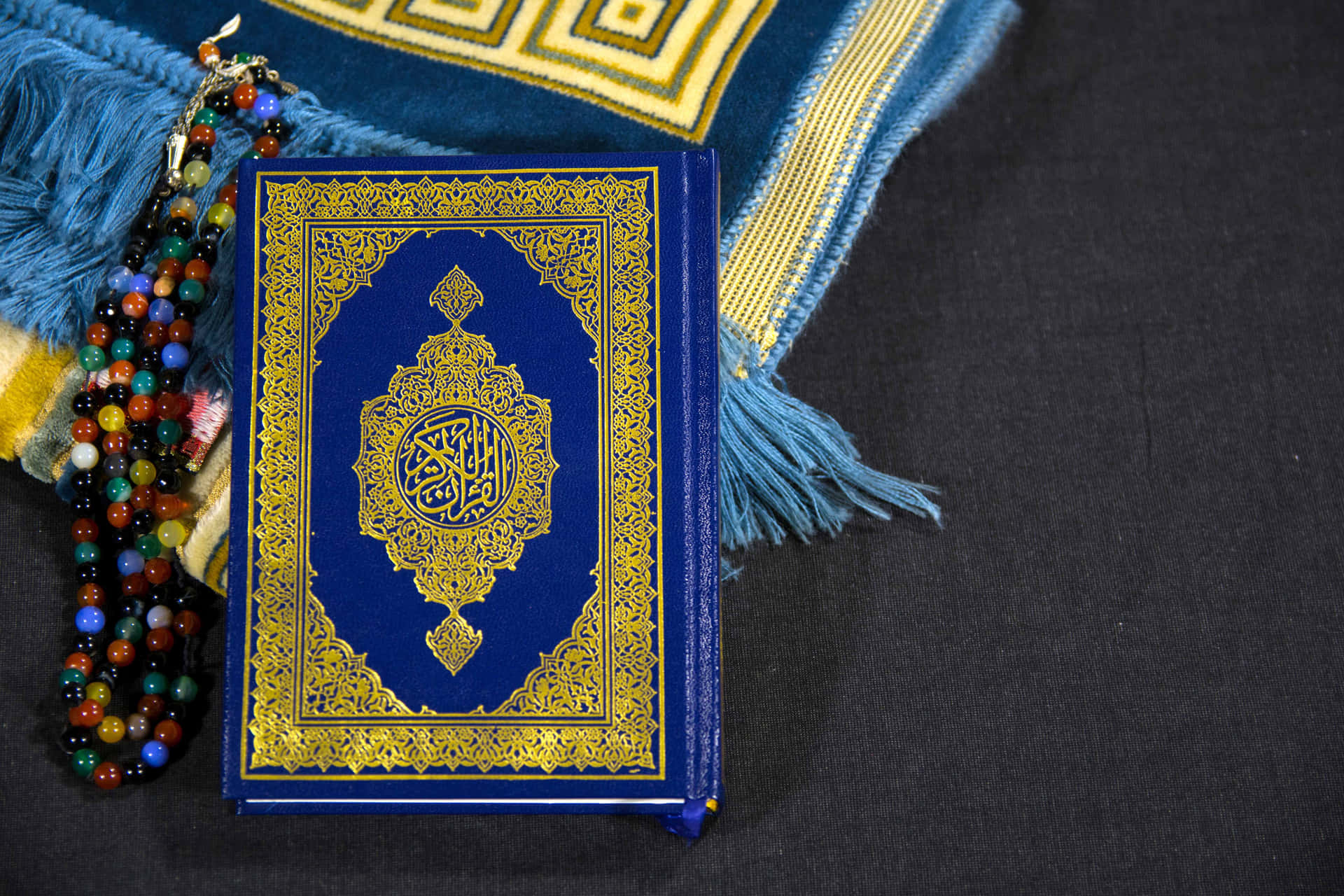 Quran Next To Beads Islamic Background