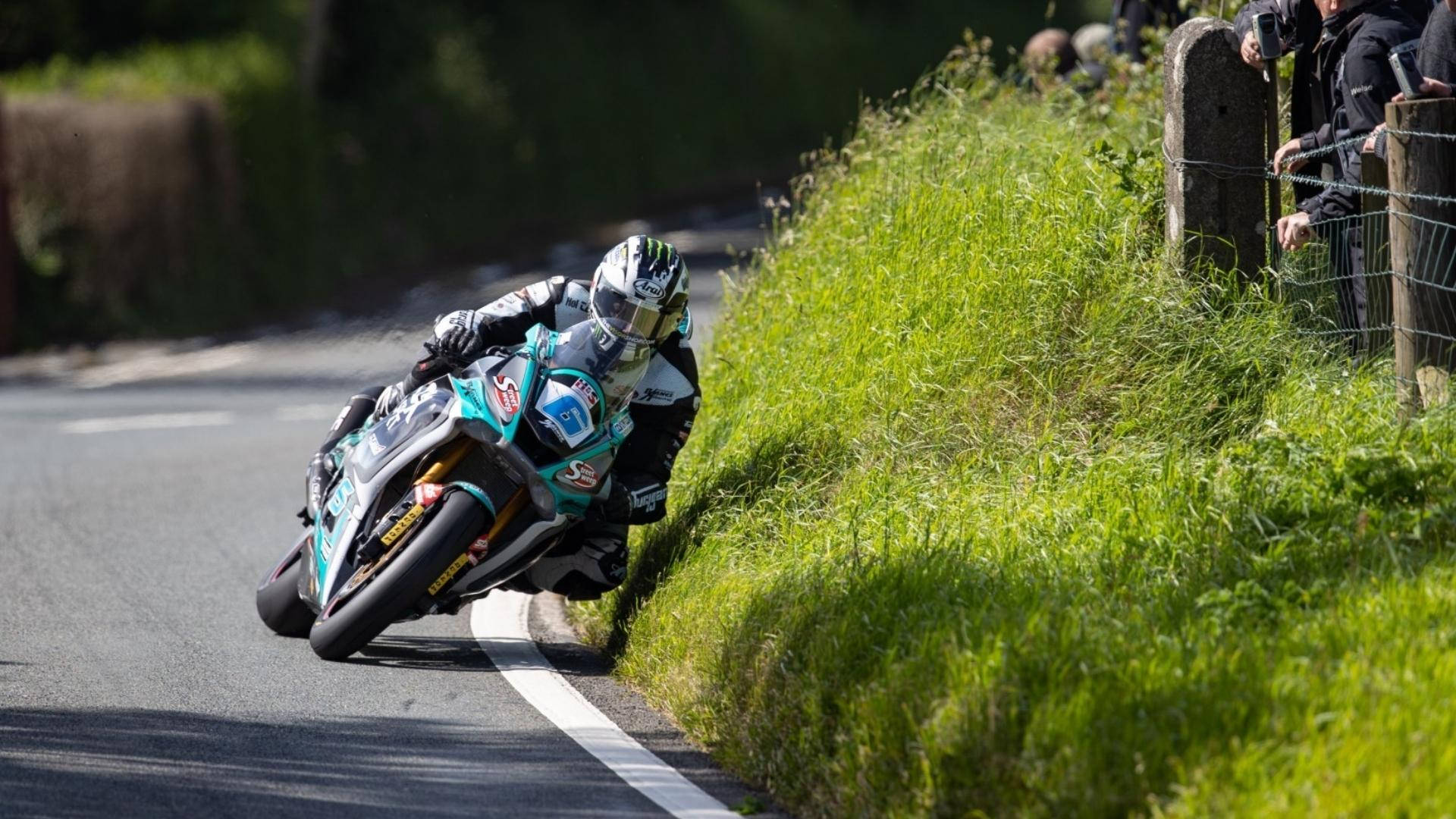 Thrilling Moments at the Isle of Mann Motorcycle Race Wallpaper