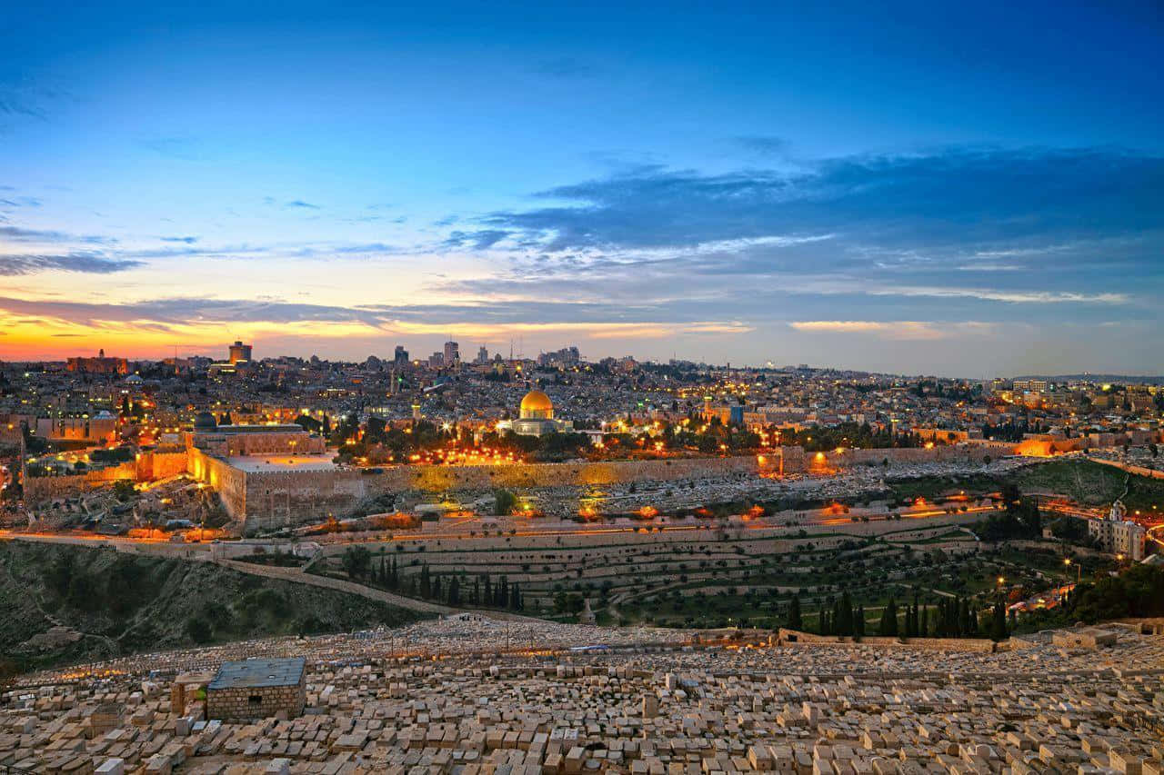 Israel's historic Old City, Jerusalem, at sunset with golden sunlight illuminating the iconic landmarks