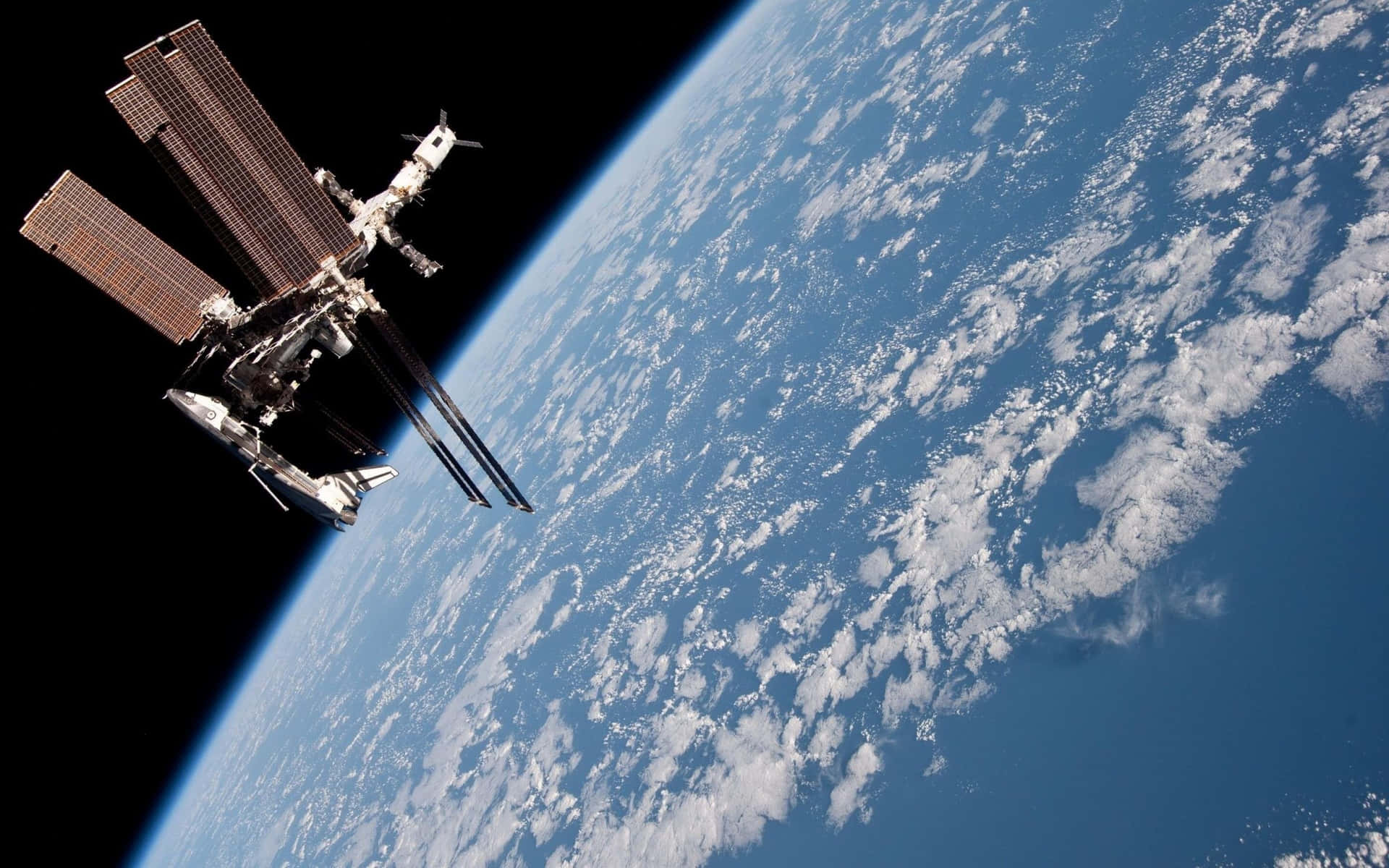 Stunning view of the International Space Station orbiting Earth Wallpaper
