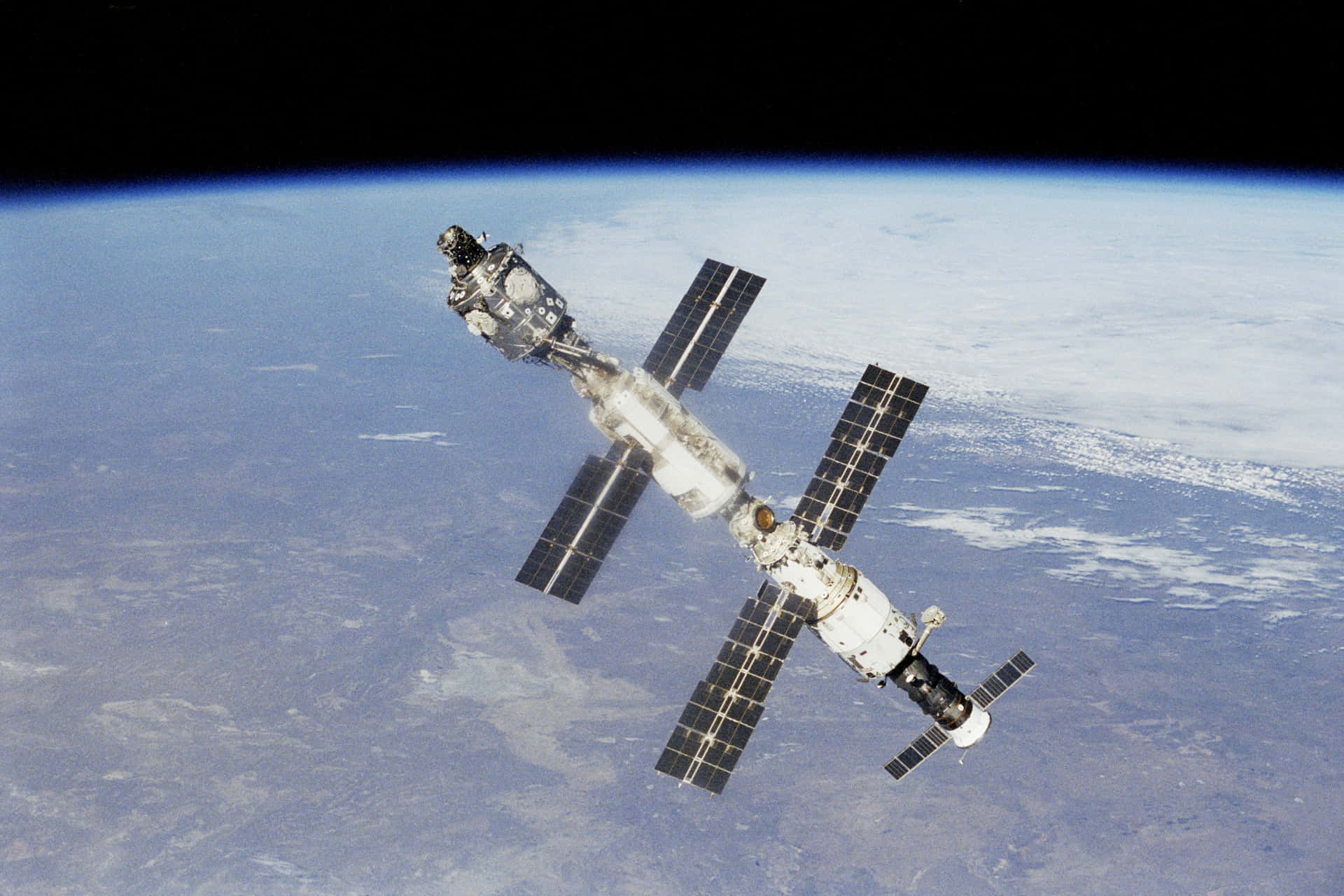 A breathtaking view of the International Space Station (ISS) orbiting Earth. Wallpaper