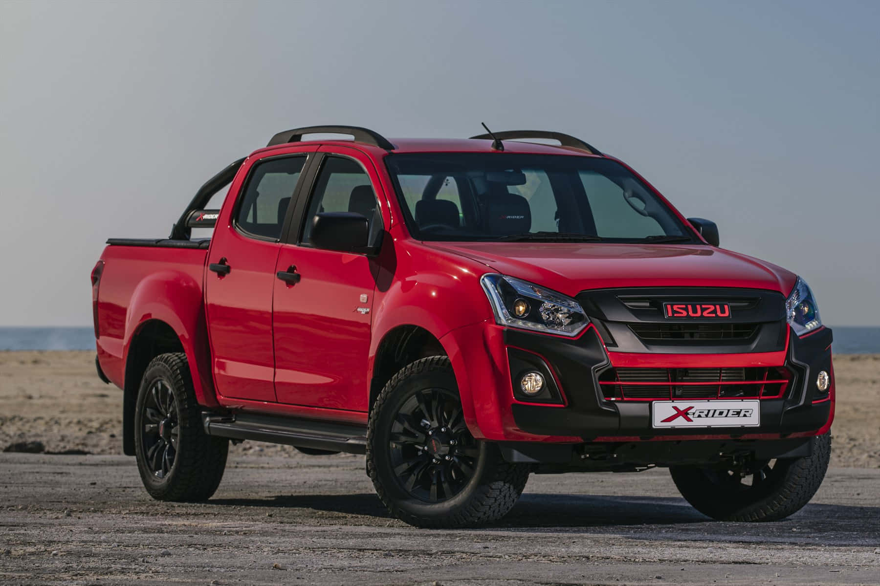 Sleek and Powerful Isuzu Vehicle Showcased on Road Wallpaper