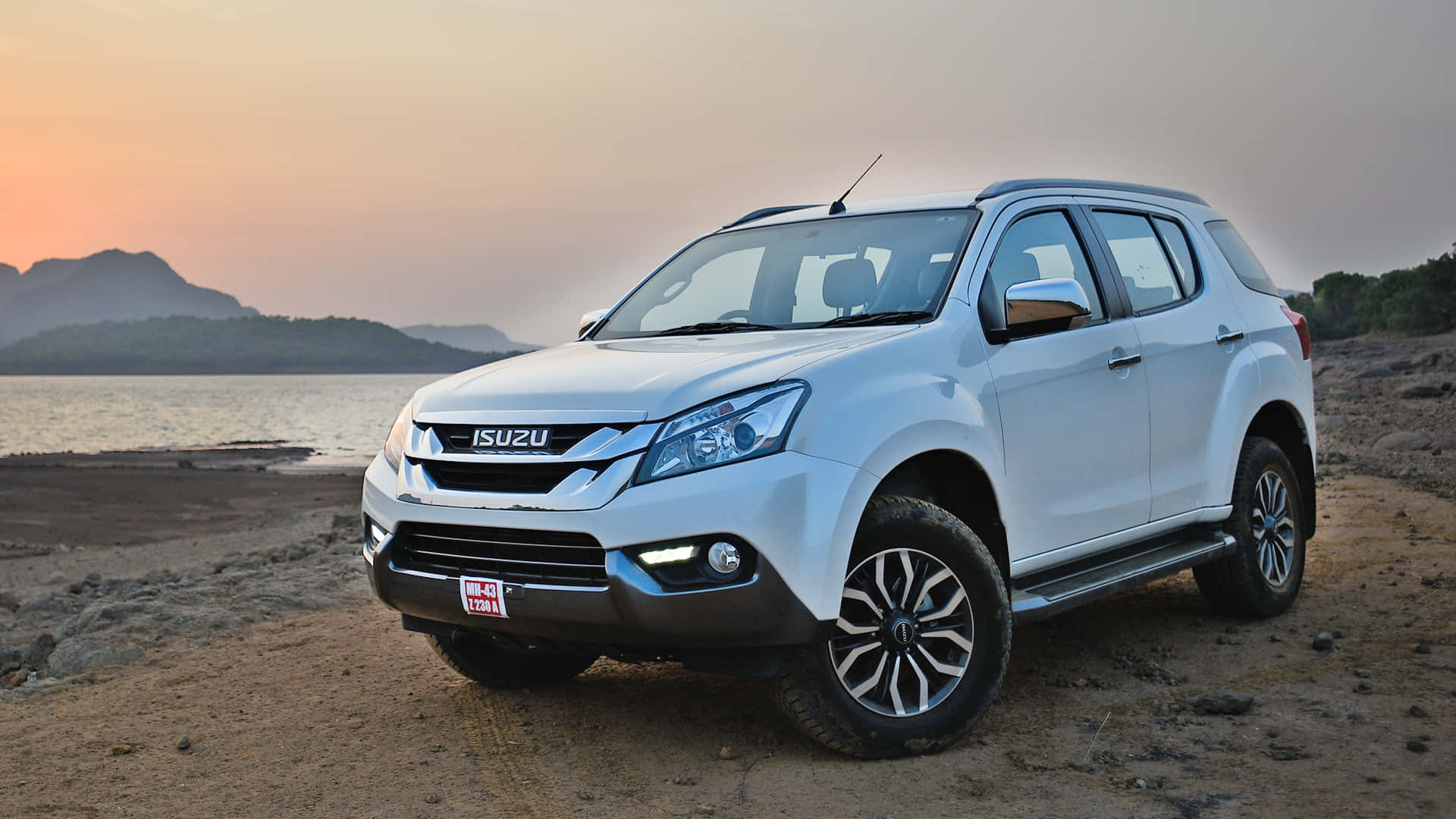 A stunning silver Isuzu D-Max truck on an adventurous journey Wallpaper