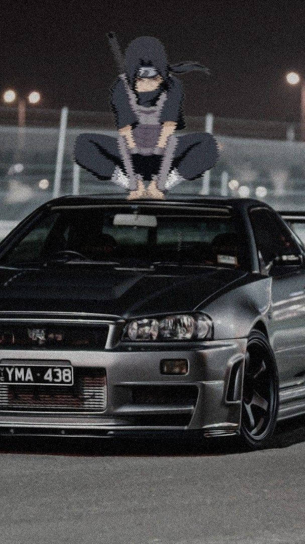 Itachi Crouching On A Car Anime Background