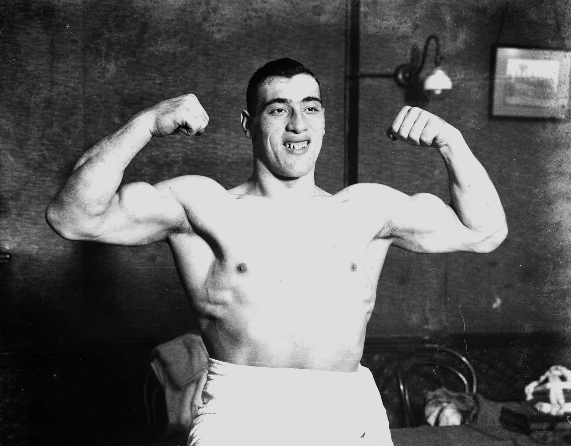 Italian Boxer Primo Carnera Flexing For People Disc Picture