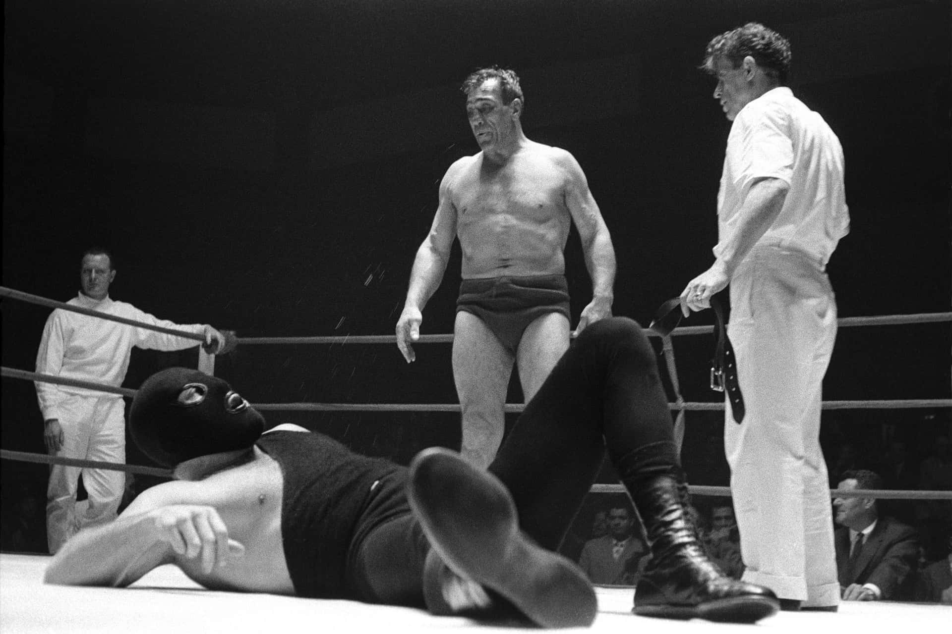 Italian Boxer Primo Carnera Staring Down The Masked Man Picture