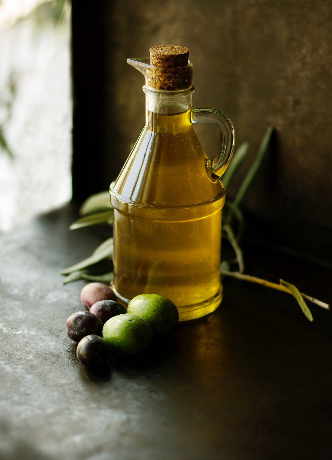 "High-Quality Italian Olive Oil with Fresh Olives" Wallpaper