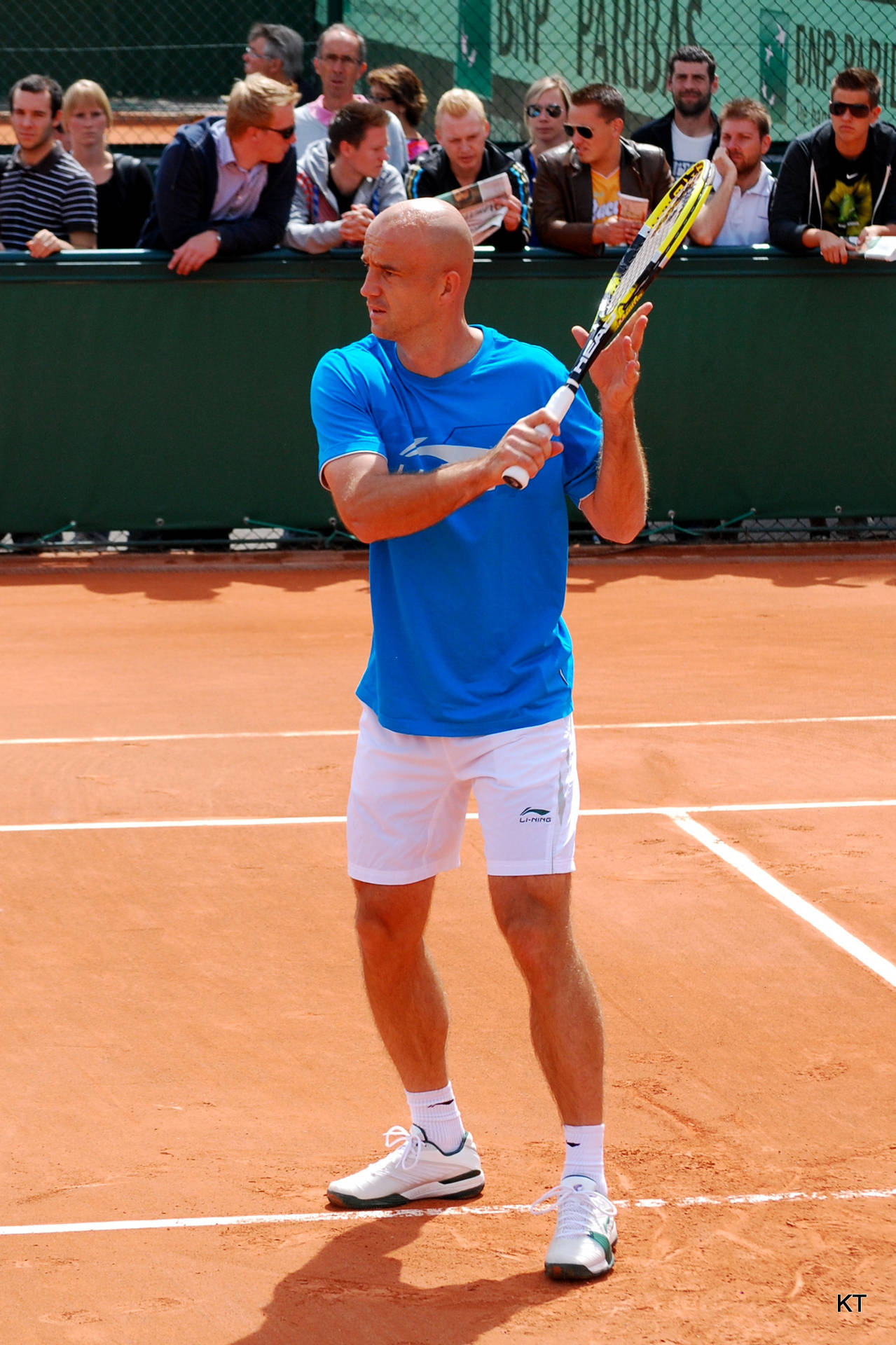 Ivan Ljubicic powerfully striking a shot on a clay court Wallpaper