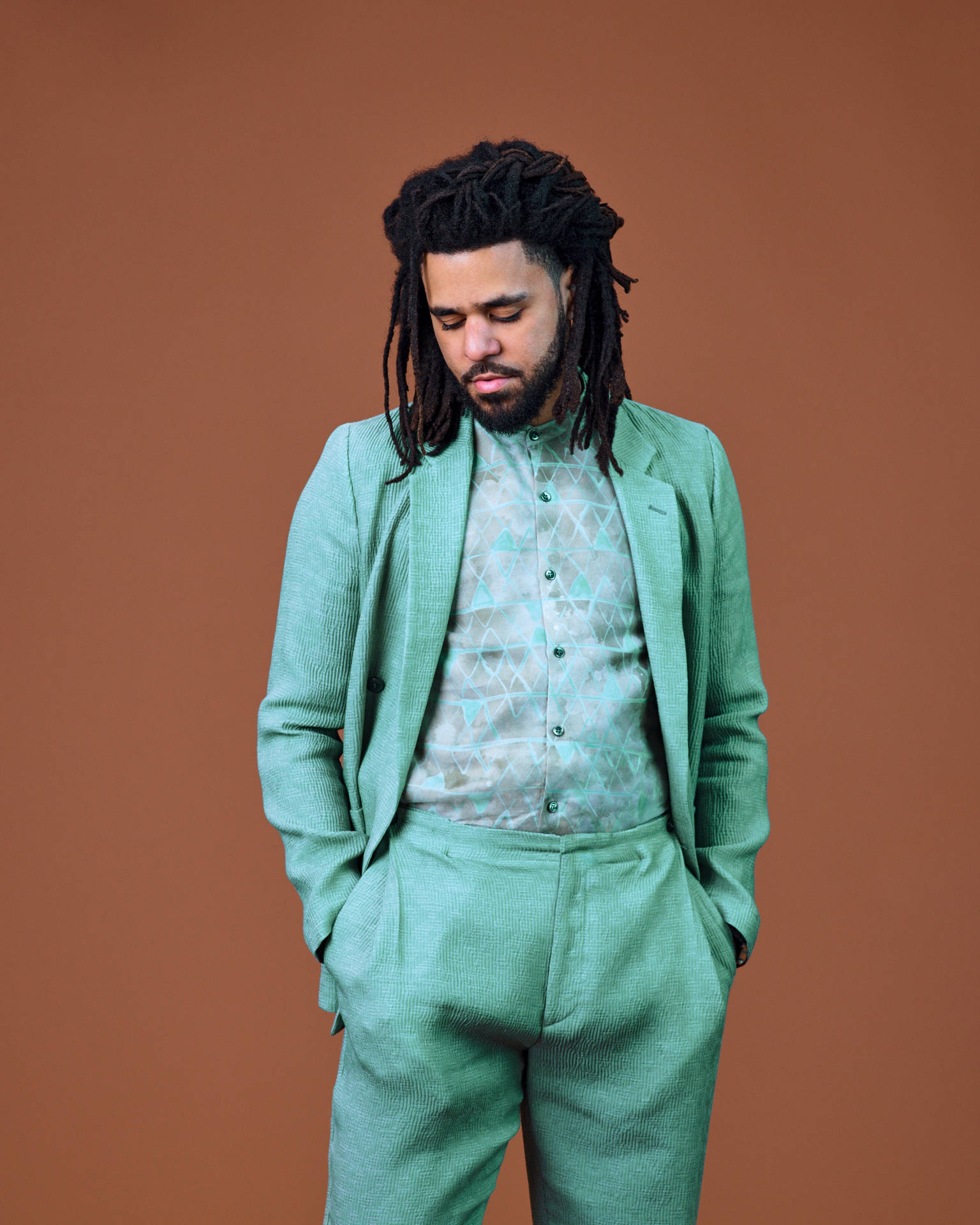 J Cole Green Suit Background