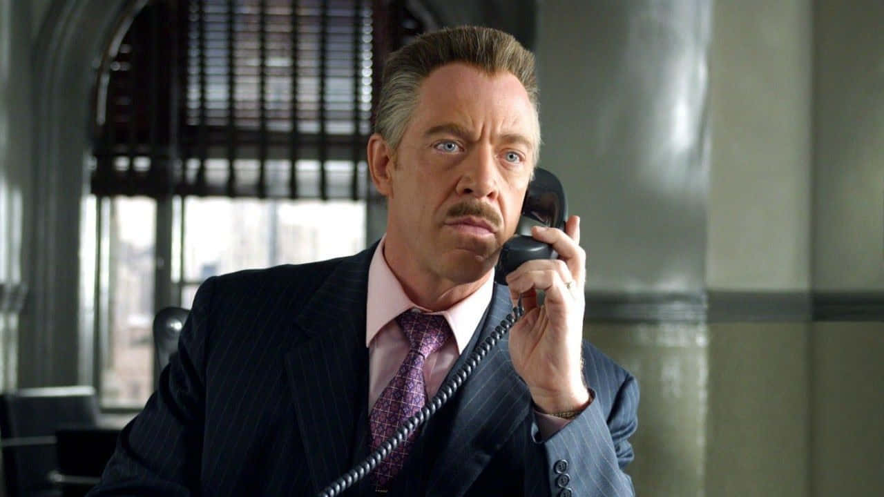 J. Jonah Jameson expressing his intense emotions in his office Wallpaper