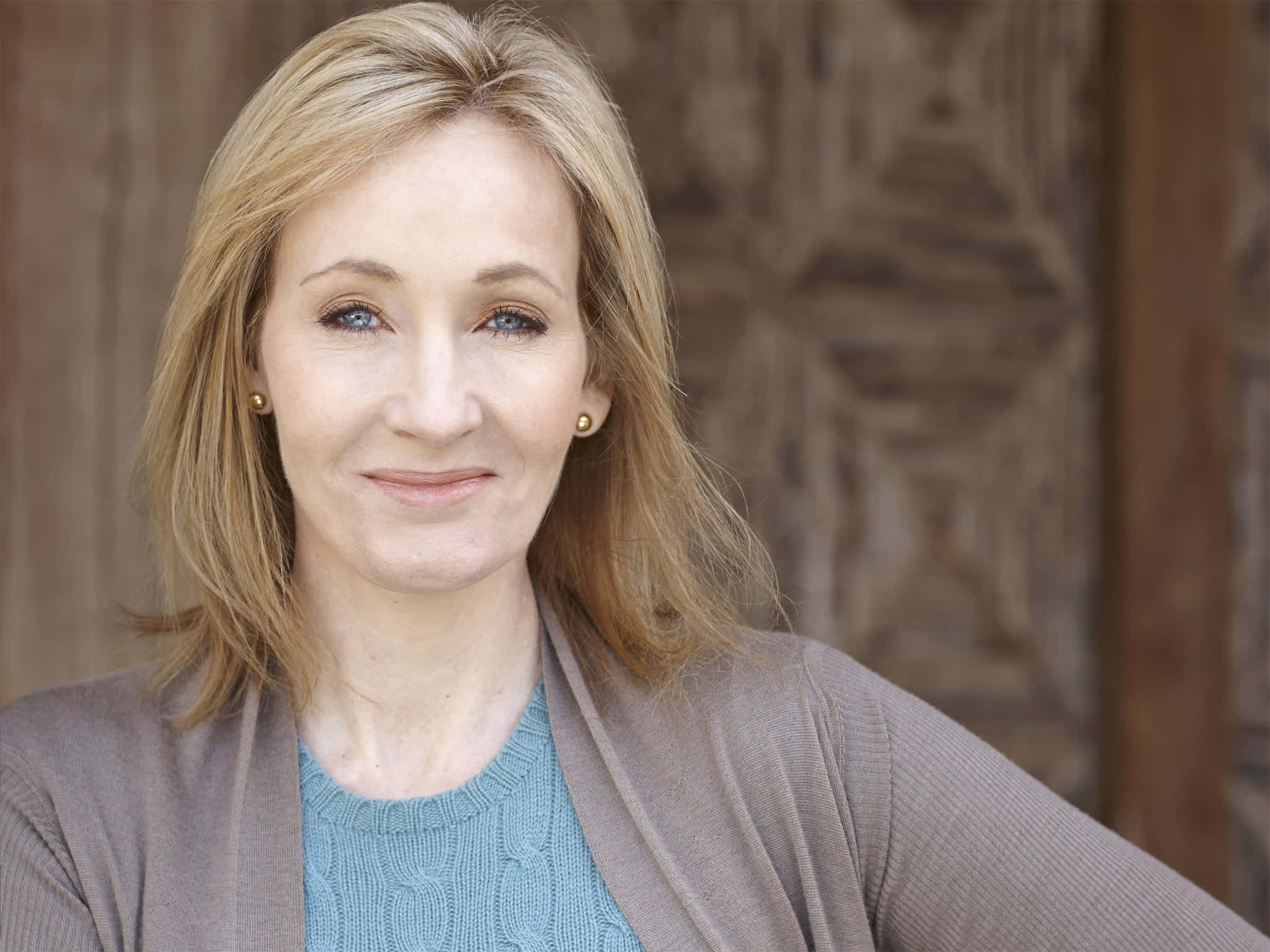 Portrait of J.K. Rowling, the renowned author of the Harry Potter series Wallpaper