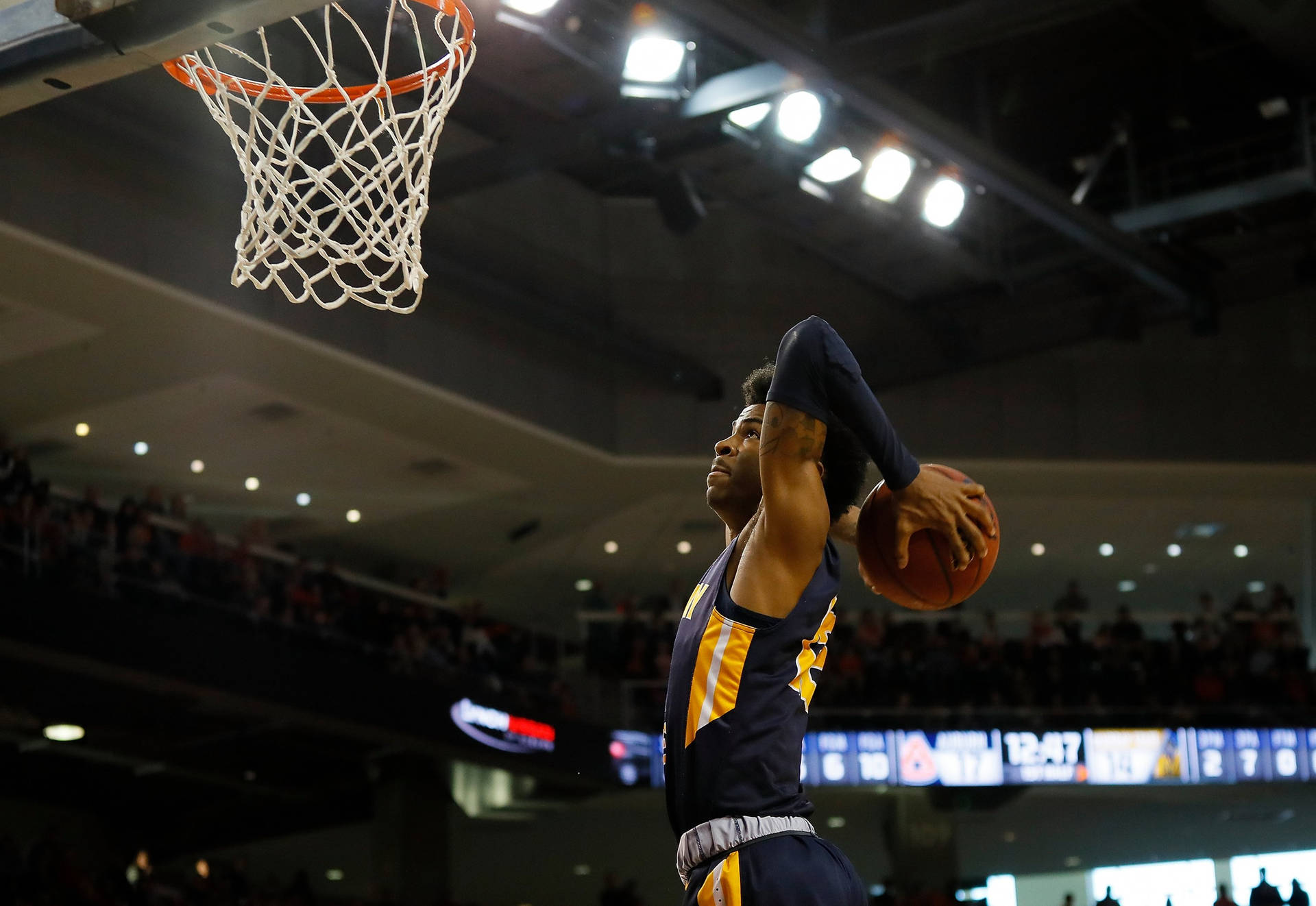 Ja Morant Dominates with Powerful Two-Hand Tomahawk Dunk Wallpaper