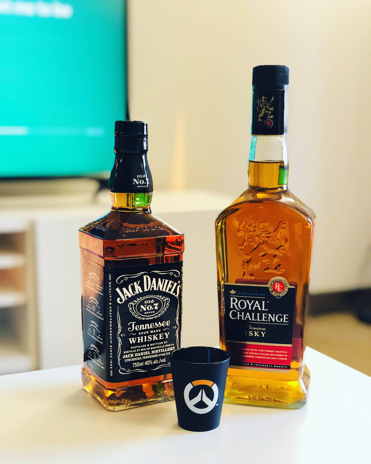 Jack Daniels And Royal Challenge Whiskey Bottles Wallpaper