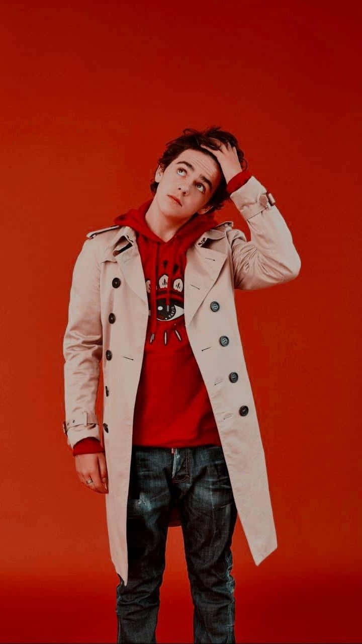 Jack Dylan Grazer Red Backdrop Wallpaper