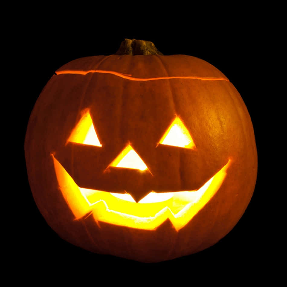 Image  A spooky Jack-o-Lantern carved from a pumpkin