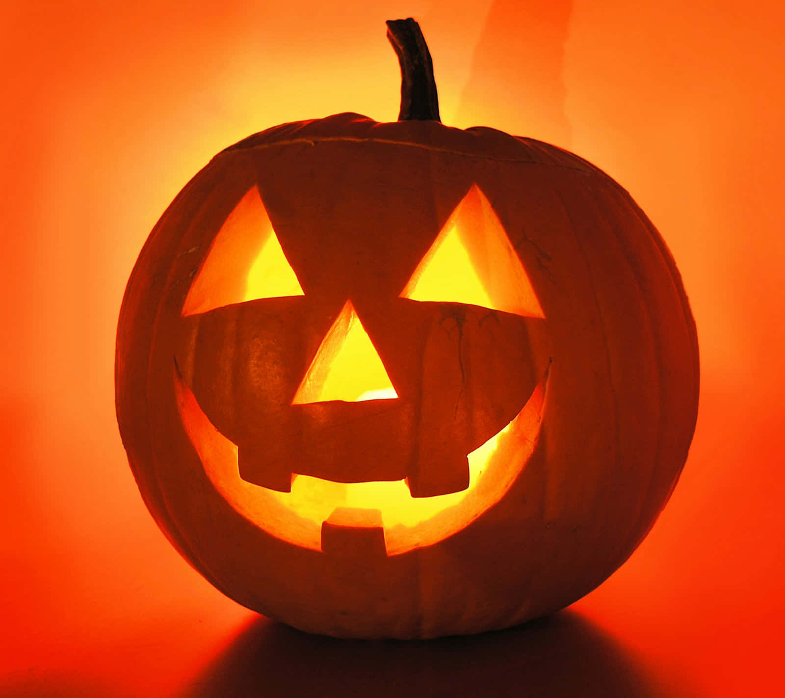 Happy Halloween! This Jack O'Lantern is Carved with a Spooky Smiley Face.