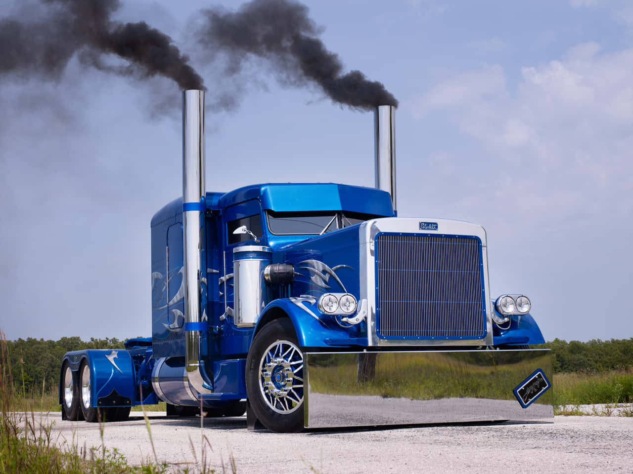 A Blue Truck With Smoke Coming Out Of Its Hood Wallpaper
