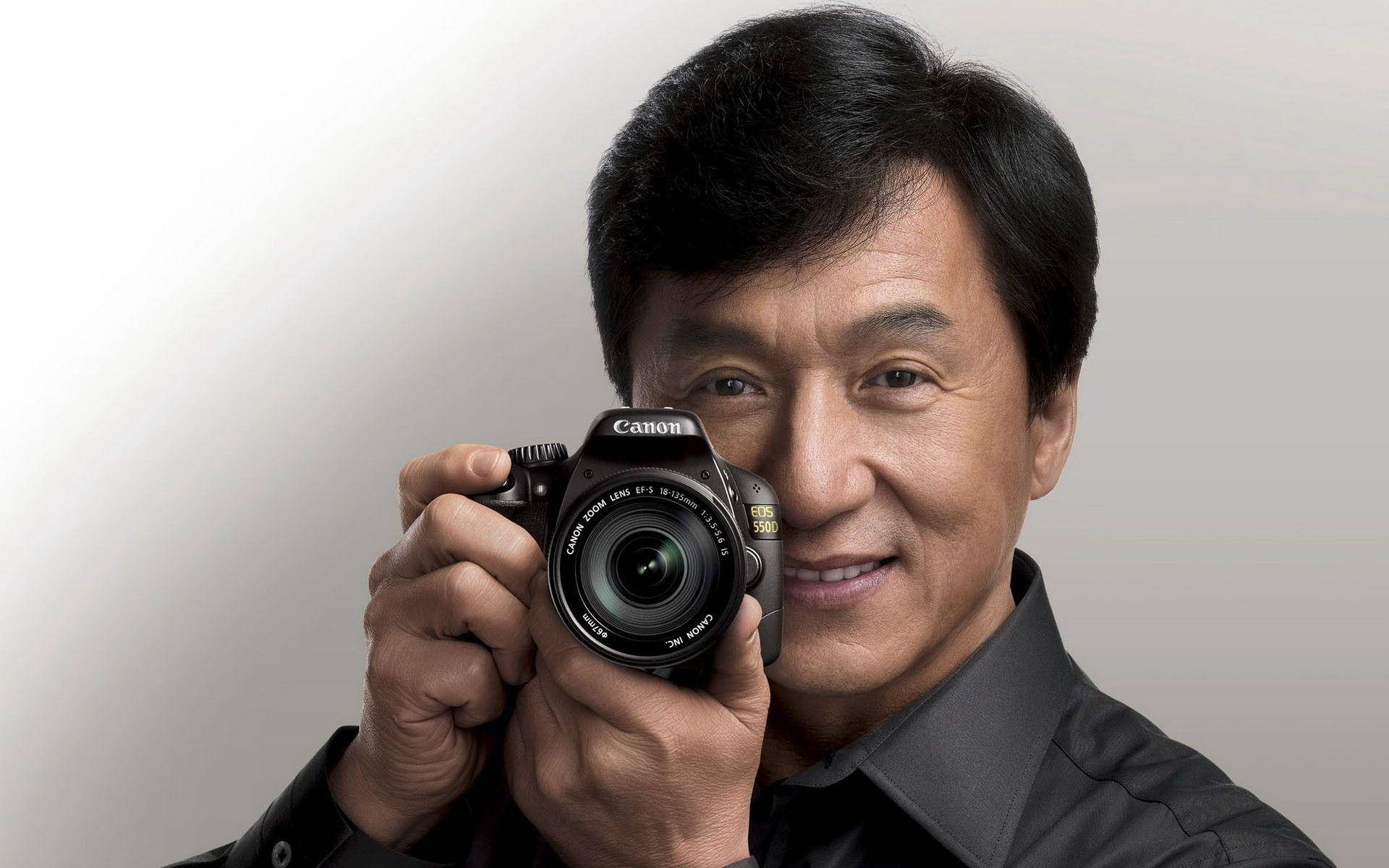 Jackie Chan Holding A Camera Wallpaper
