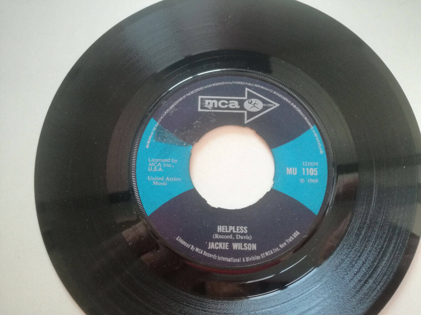 Soul Legend Jackie Wilson holding a vinyl record Wallpaper