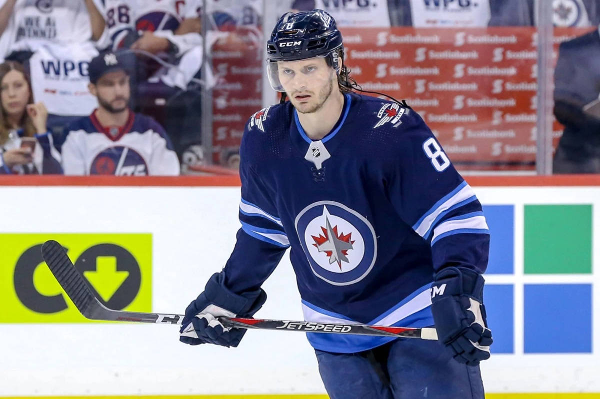 Jacob Trouba Fierce Expression While Focusing On The Game Wallpaper