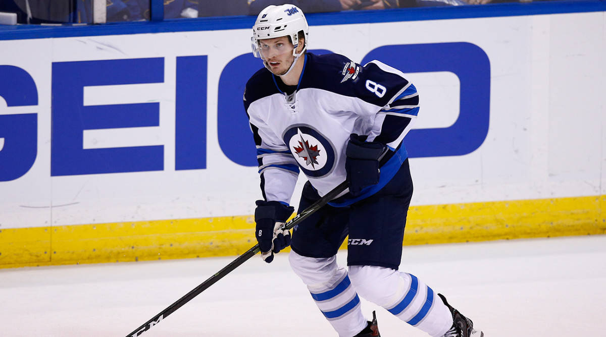 Jacob Trouba From Winnipeg Jets Gliding On Ice During Game Wallpaper
