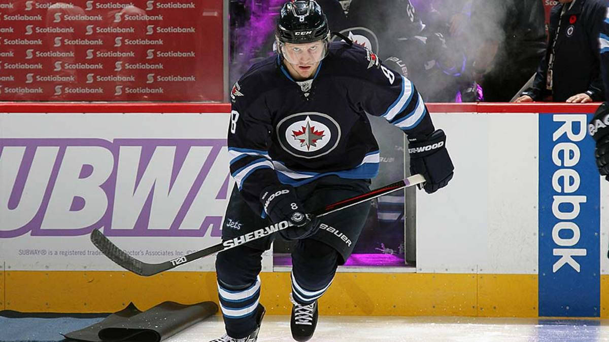 Jacob Trouba Gliding During Game While Holding Hockey Stick Wallpaper
