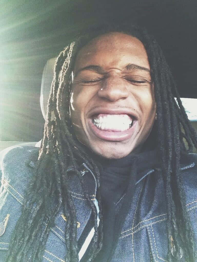 Jacquees Smiling Inside The Car Wallpaper