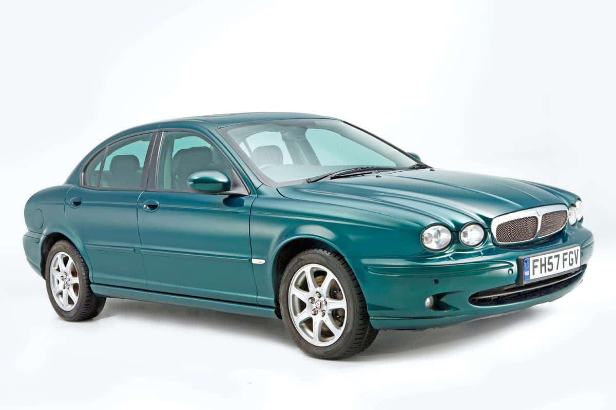 Sleek and stylish Jaguar X-Type in action Wallpaper