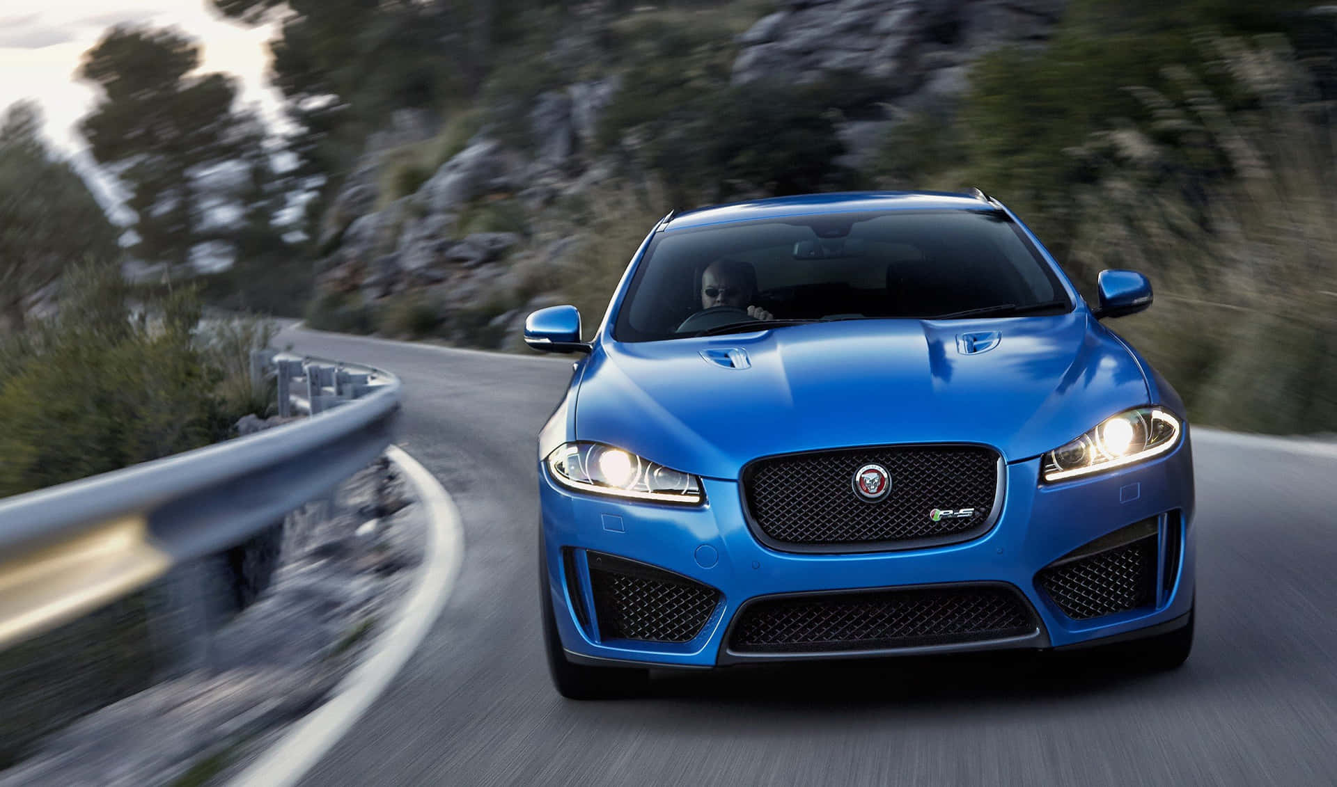 Sleek and Powerful Jaguar XFR on the Road Wallpaper