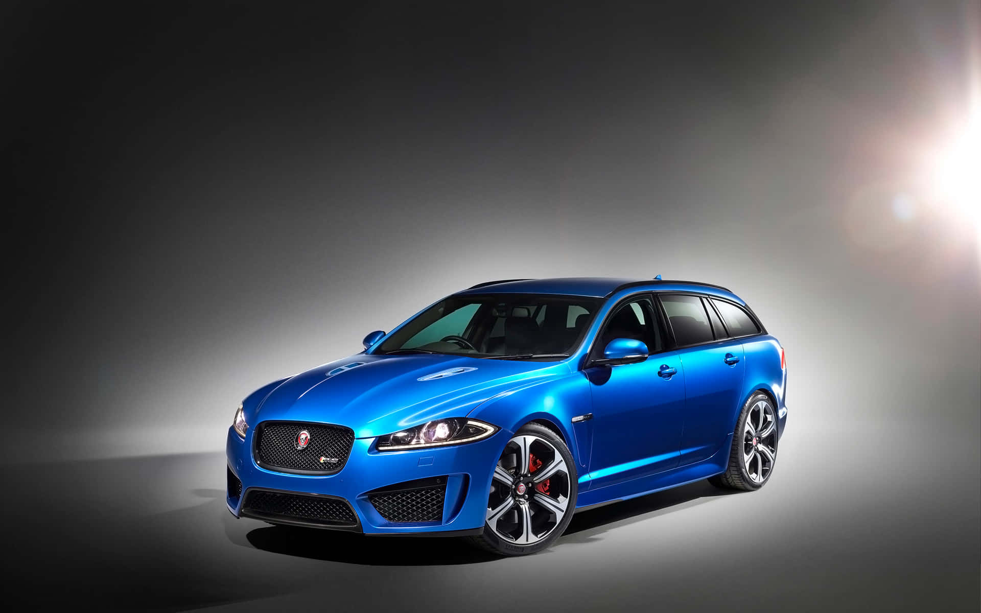 Caption: Dynamic and Stylish Jaguar XFR in Action Wallpaper