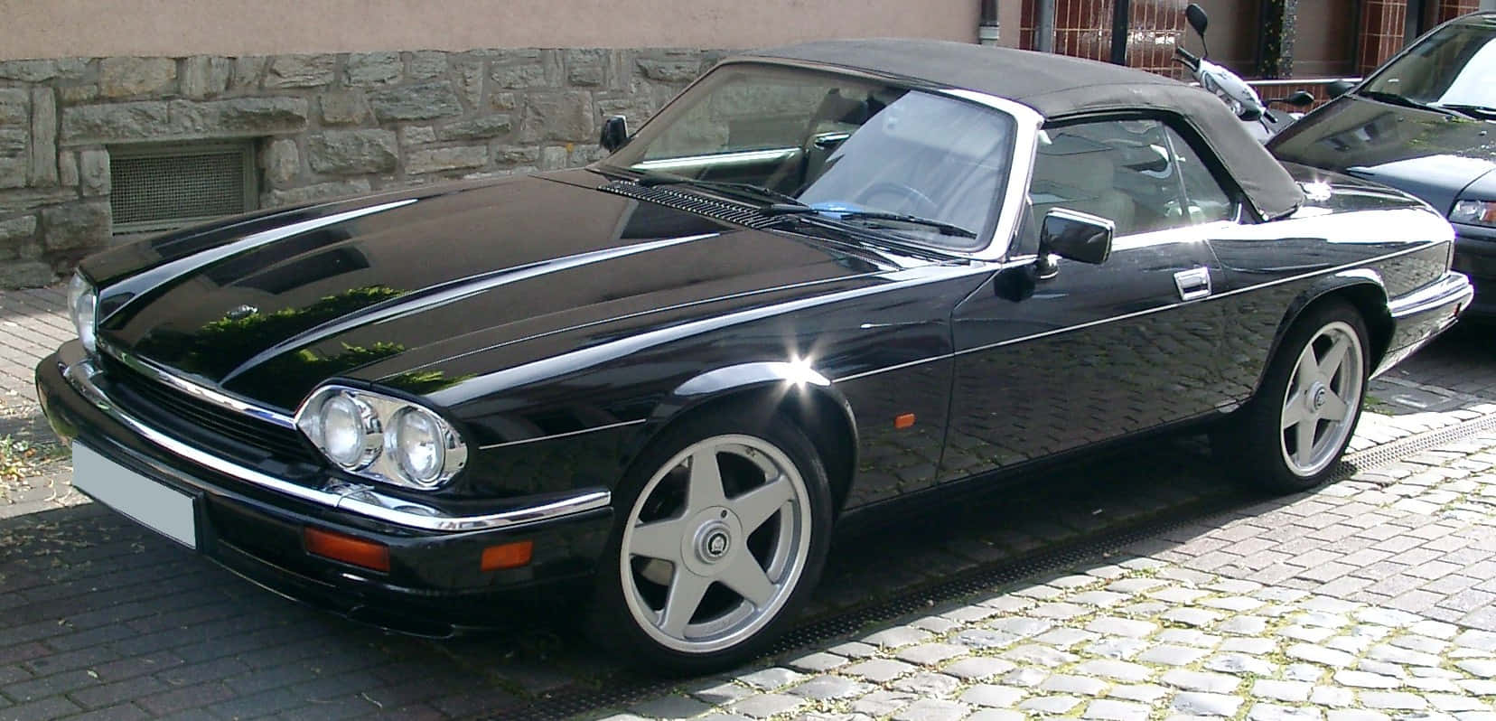 Elegant Jaguar XJS in motion Wallpaper