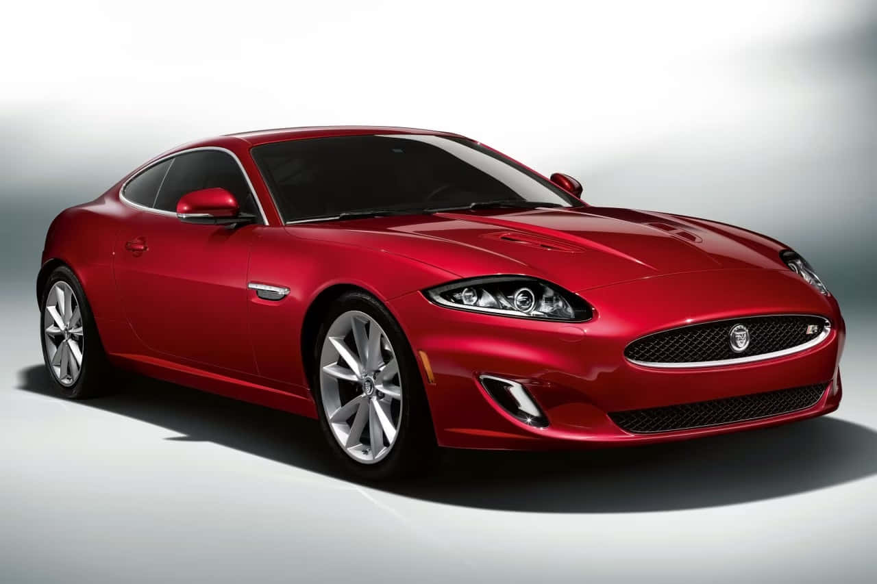 Sleek Red Jaguar XKR in Motion Wallpaper