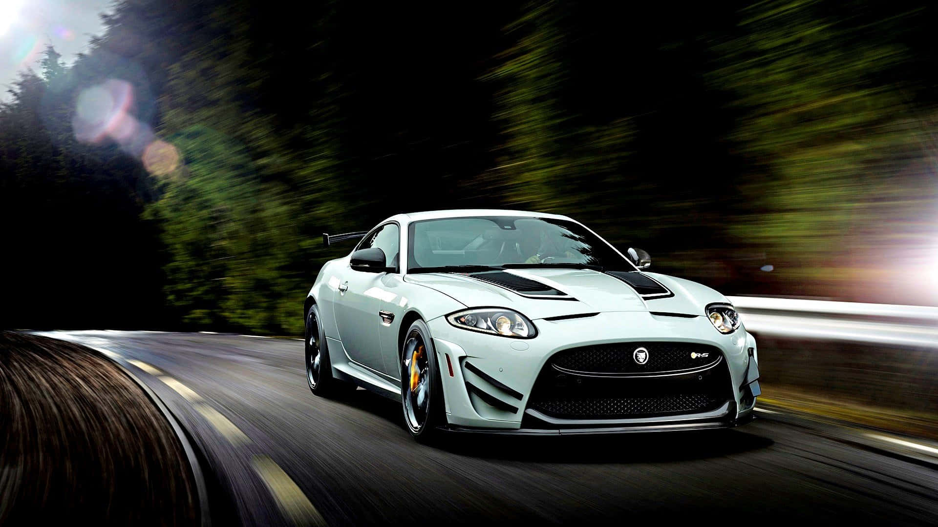 Sleek Jaguar XKR in Action Wallpaper