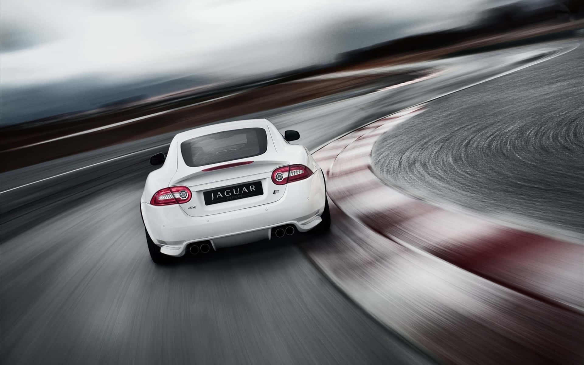Captivating Jaguar XKR in Motion Wallpaper