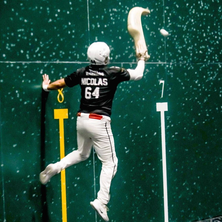 A Professional Jai Alai Player in Action Wallpaper