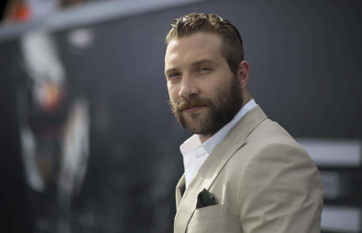 Download Jai Courtney Suave Look Event Wallpaper | Wallpapers.com