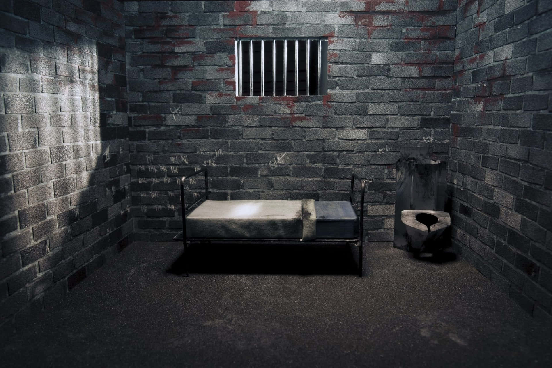 En seng i et fængselscelle.
