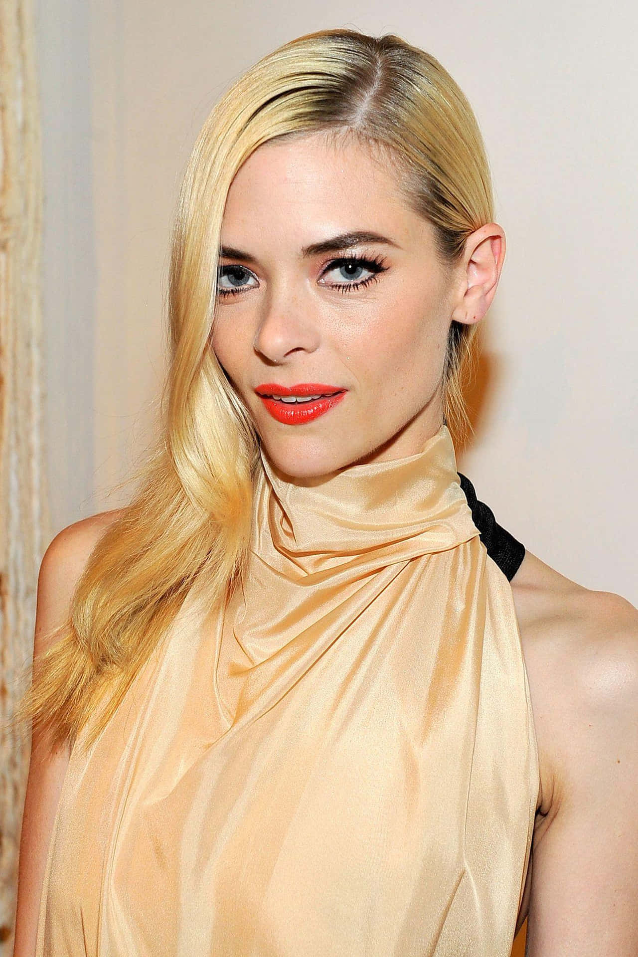 Jaime King striking a pose in a stylish outfit Wallpaper