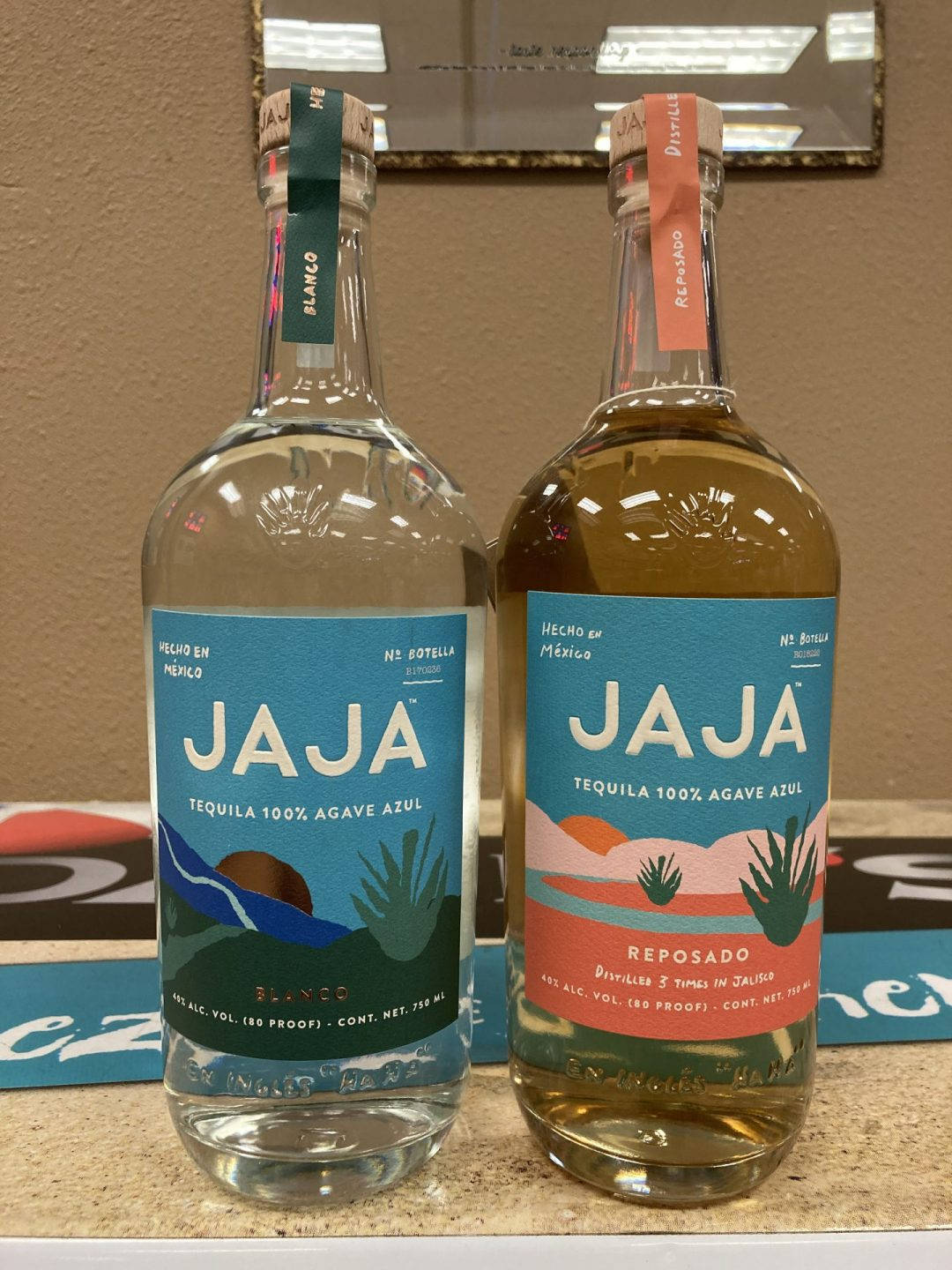 Caption: Premium JAJA Tequila Blanco and Reposado Bottles Wallpaper