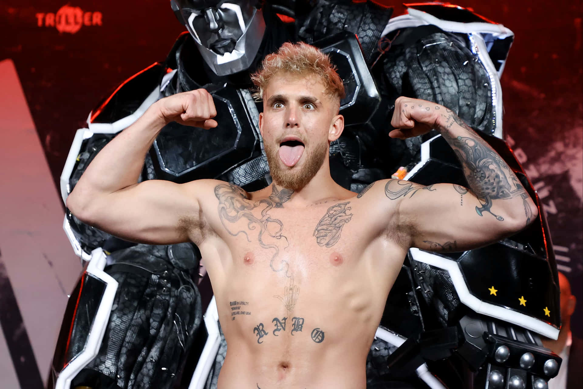 Jake Paul Flexingwith Robot Background Wallpaper