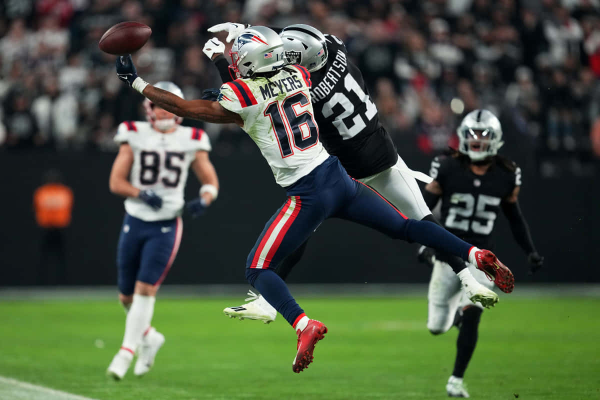 Jakobi Meyers Catching Football In Game Wallpaper