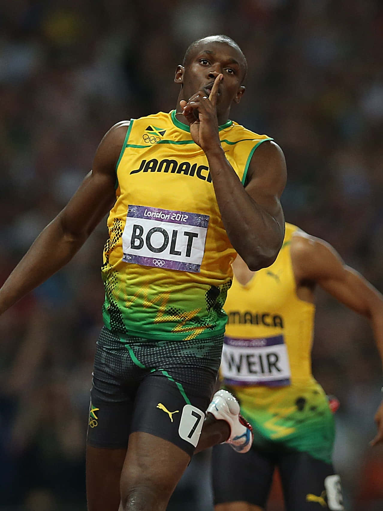 Jamaikanischerathlet Usain Bolt Hebt Den Finger Hoch. Wallpaper