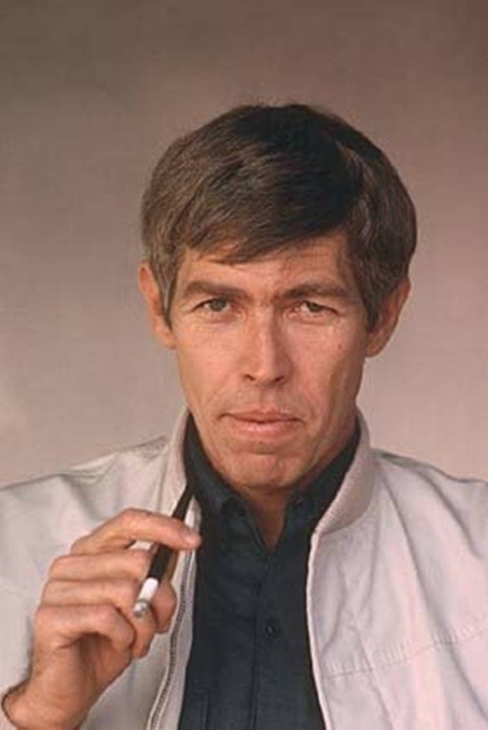 James Coburn With A Cigarette On A Filter Wallpaper