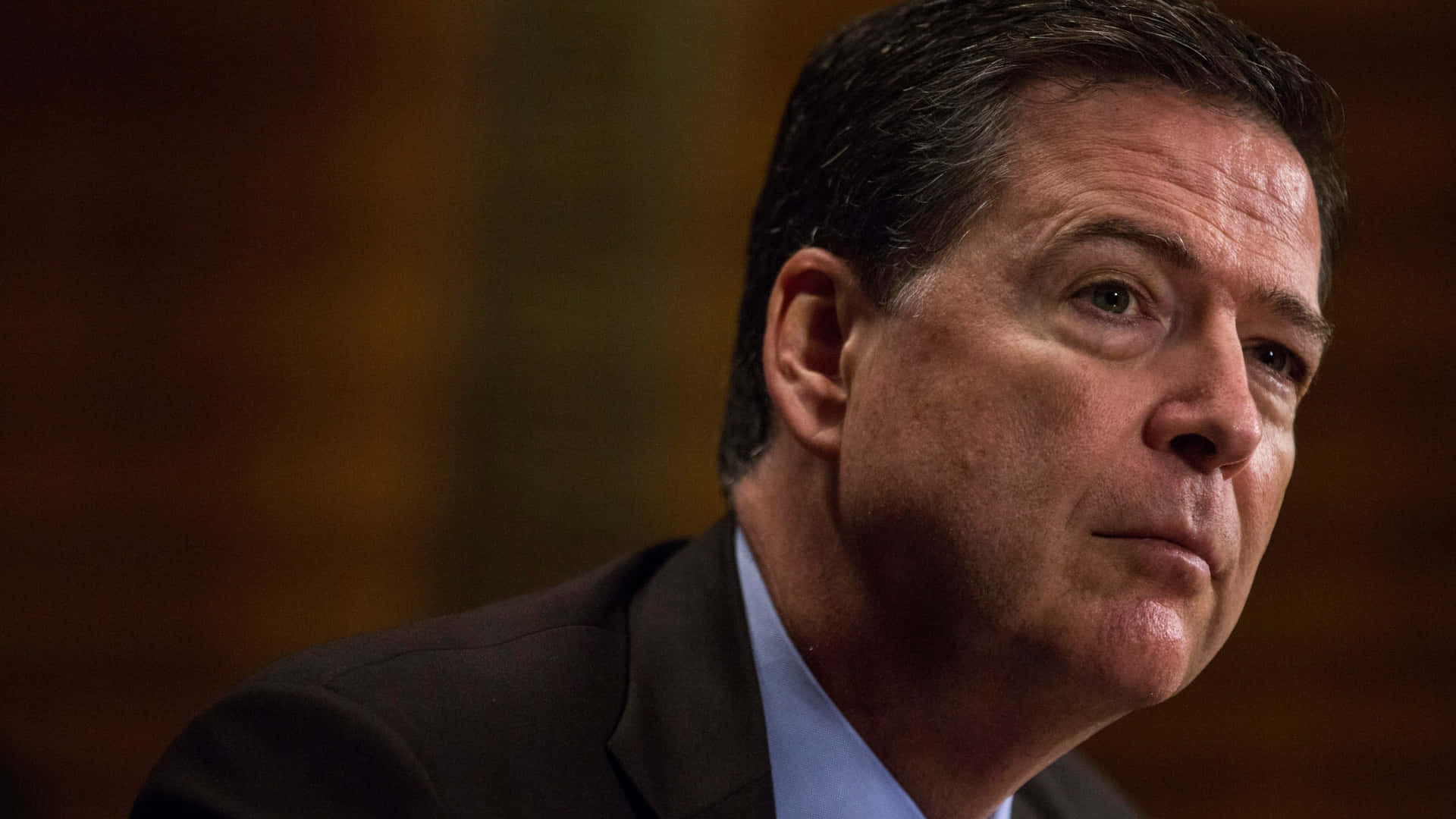 James Comey Intense Gaze Wallpaper